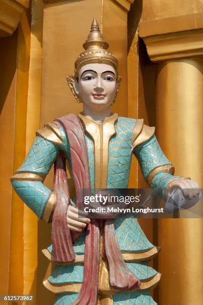 a religious statue at shwedagon pagoda, yangon, (rangoon), myanmar, (burma) - rangun stock pictures, royalty-free photos & images