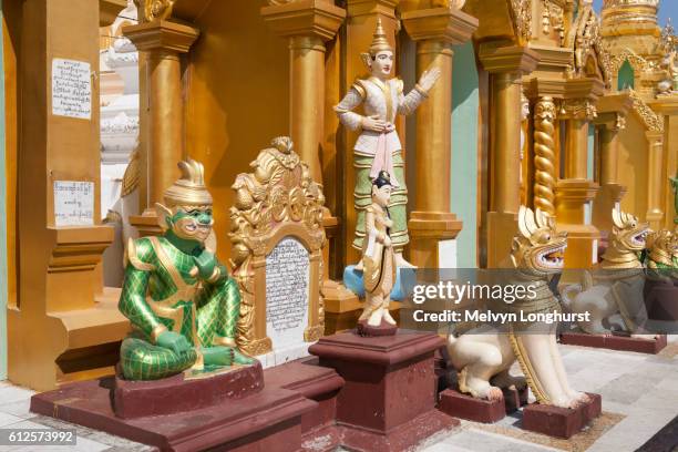 religious statues at shwedagon pagoda, yangon, (rangoon), myanmar, (burma) - rangun stock pictures, royalty-free photos & images