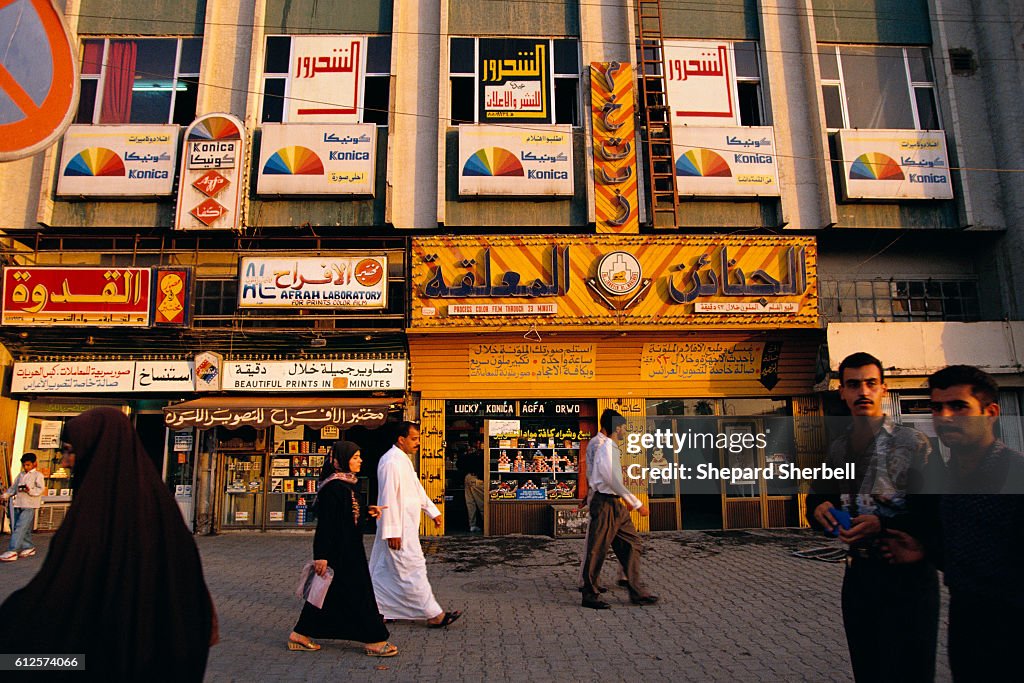 Shop 41 Rashid Pedestrians walking through a renovated section of Al Rashid Street ...