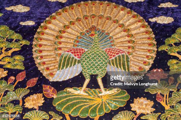 embroidery depicting a peacock, mandalay, myanmar, (burma) - racing silks fotografías e imágenes de stock