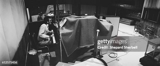 Musician Randy Newman playing the piano during recording sessions for Good Old Boys at Amigo Studios in Los Angeles.