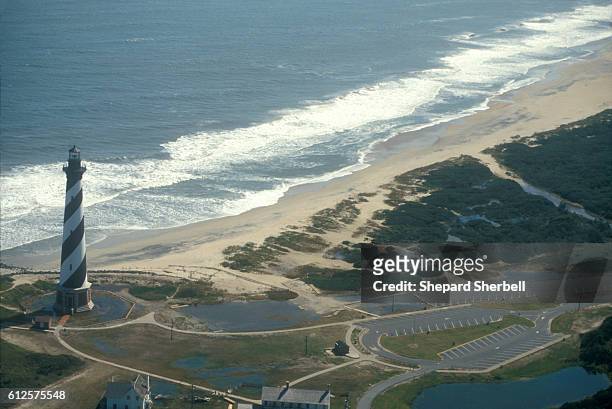 Beach erosion threatens Cape Hattaras Lighthouse. | Location: Cape Hattaras, North Carolina, USA.