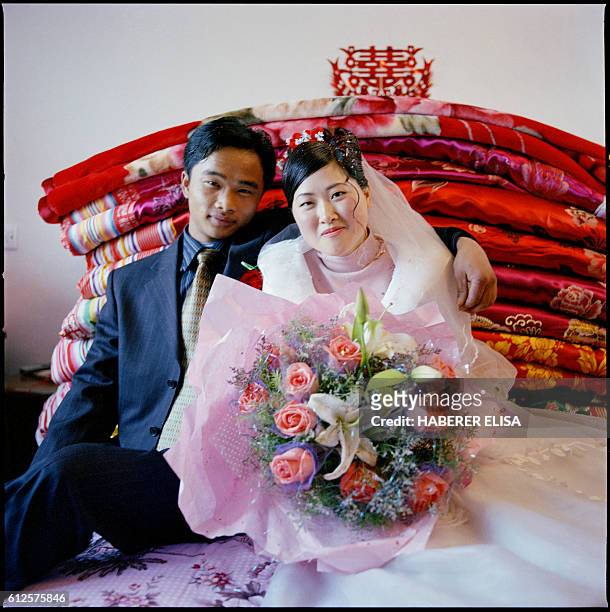 Ding Zhifa and Cai Xingju wed in Wei Ding, a village of 400 inhabitants located 150 kilometers from Hefei, capital of the Anhui province. The couple...
