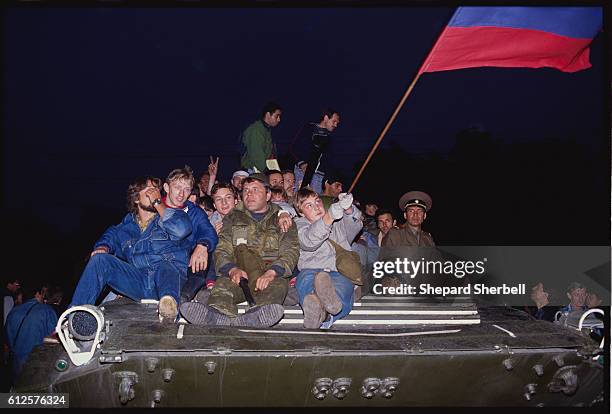 Civilians Sitting on a Military Tank During the Soviet Coup Attempt