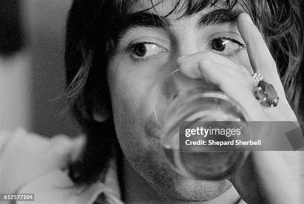 Keith Moon Drinking Beer at Home