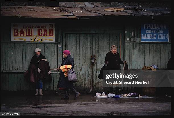 Poor Soviet women of all generations sell clothing at the Tichinsky Market in a low-income section of Moscow.