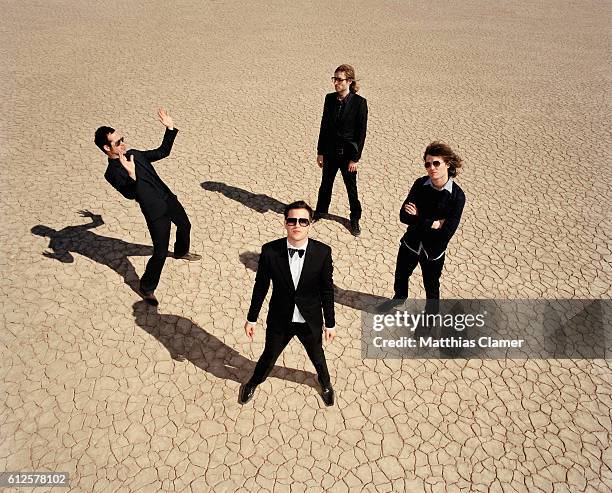 Ronnie Vannucci, Mark Stoermer, Dave Keuning and Brandon Flowers. Styling by Julie Ragolia. Grooming by Kumi Craig. On Brandon, light-blue...