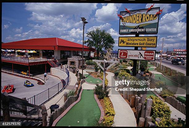An amusement center in Branson, Missouri, offers fun for visiting tourists. With over 30 theaters performing live shows daily, Branson draws music...