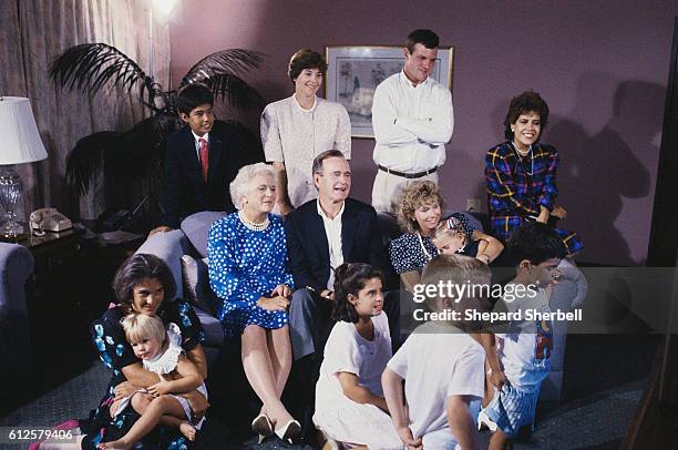 Vice President George Bush, his wife Barbara, and members of his family await the announcement of the Republican nomination for president in their...