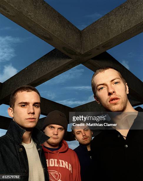 From left to right are Guy Berryman, Will Champion, Jon Buckland, and Chris Martin.