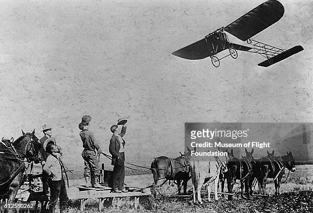 French aviator Louis Paulhan flying a French-made Bleriot XI sport monoplane over watching farmers at the Dominguez Ranch during the Los Angeles...