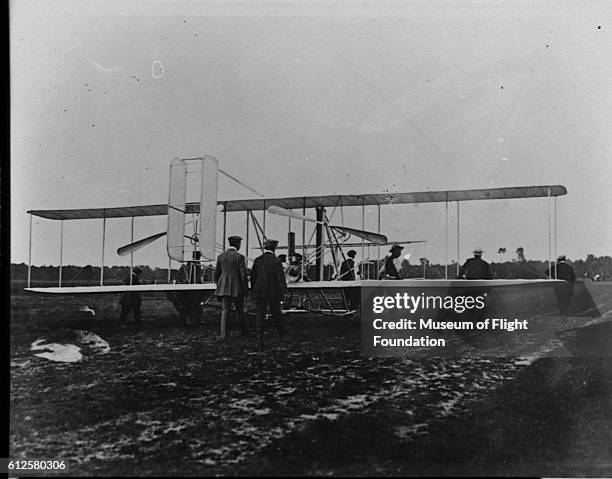 The 1908 Wright Flyer biplane in a field in Auvours, France for a demonstration flight. | Location: Auvours, France.