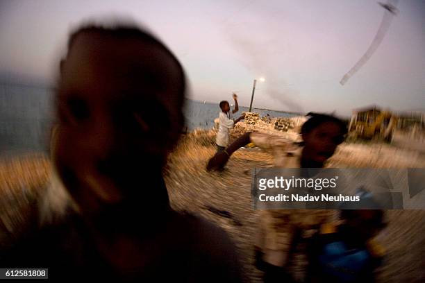 Kids playing in the refugee camp that opened after the 7.0 earthquake next to city port Au Prince on the way to the city of Leogane. In Haiti on...