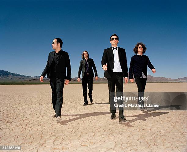 Ronnie Vannucci, Mark Stoermer, Brandon Flowers and Dave Keuning. Styling by Julie Ragolia. Grooming by Kumi Craig. On Brandon, light-blue...
