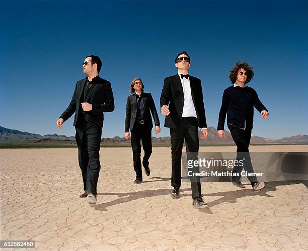 Ronnie Vannucci, Mark Stoermer, Brandon Flowers and Dave Keuning. Styling by Julie Ragolia. Grooming by Kumi Craig. On Brandon, light-blue...