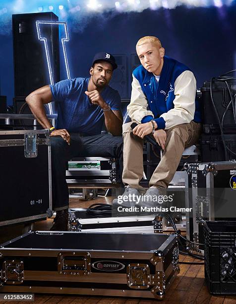 Rapper Eminem and football player Calvin Johnson are photographed for ESPN Magazine, The Music Issue on December 17, 2013 at St Andrews Theater in...