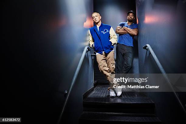 Rapper Eminem and football player Calvin Johnson are photographed for ESPN Magazine, The Music Issue on December 17, 2013 at St Andrews Theater in...