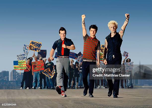 The members of Green Day march in protest of the Bush administration. L-R are Tre Cool, Billie Joe Armstrong, and Mike Dirnt.