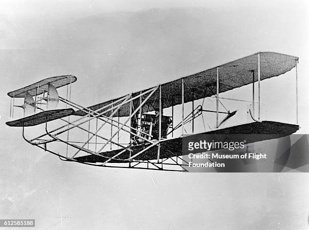 Pilot Wilbur Wright takes his Wright Flyer prototype biplane on a demonstration flight in Germany in the Fall of 1909. | Location: Tempelhof Field,...