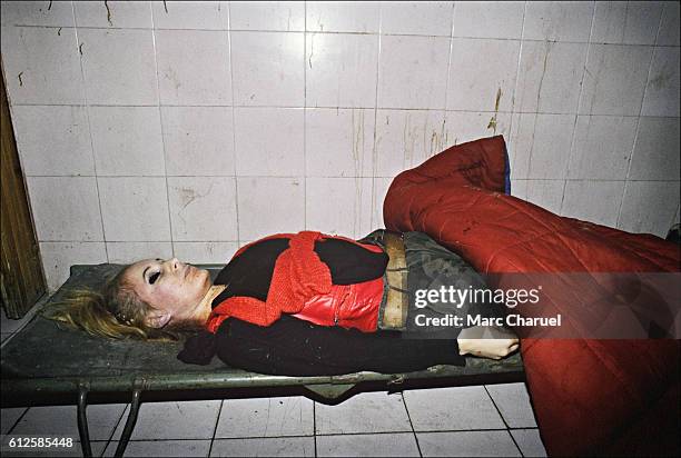 The dead body of a female fighter of the Bosnian militia, killed on the front line and abandoned to the morgue of the Kosevo Hospital, in Sarajevo.