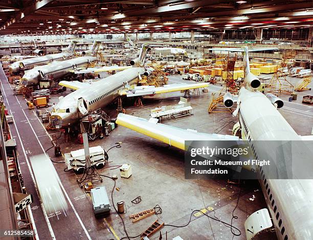 Looking down on the final assembly line at the Boeing Plant in Renton, Washington. The planes are the 727 passenger transports, one of Boeing's most...
