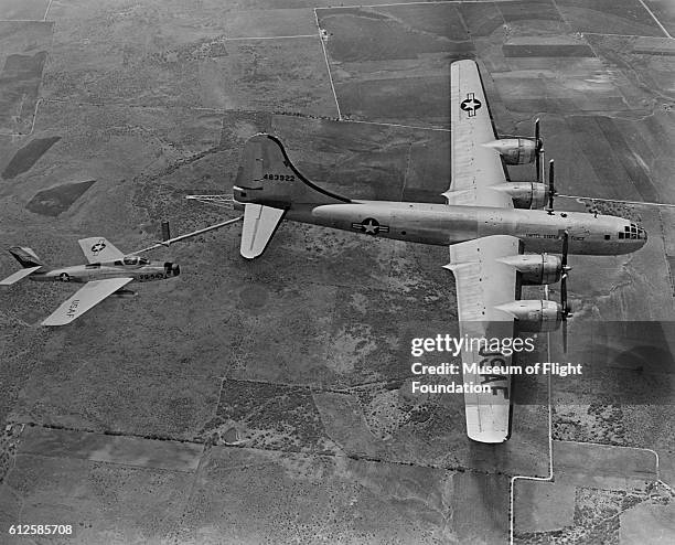 Air Force F-84F fighter, "Thunderstreak" refuels from a Boeing B-29, the "Superfortress" during operations in the mid-1950's.