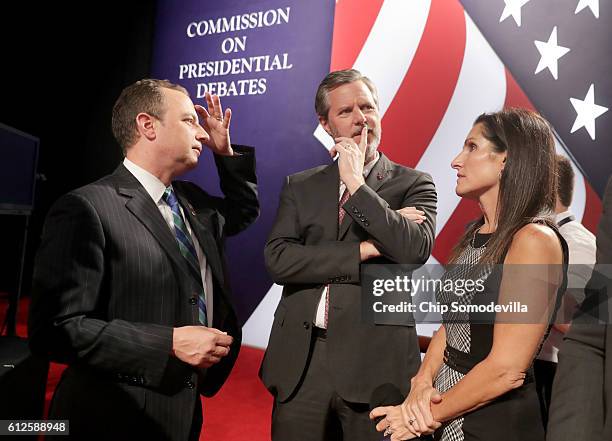 Reince Priebus, chairman of the Republican National Committee, Jerry Falwell Jr and Becky Tilley speak prior to the Vice Presidential Debate between...