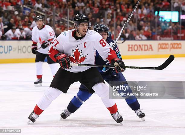 Sidney Crosby of Team Canada battles for position with Mats Zuccarello of Team Europe during Game Two of the World Cup of Hockey final series at the...