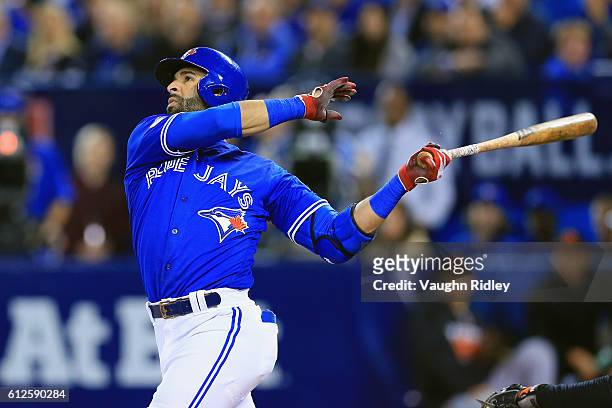 Jose Bautista of the Toronto Blue Jays hits a solo home run in the second inning against the Baltimore Orioles during the American League Wild Card...