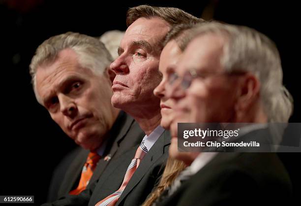 Virginia Gov. Terry McAuliffe and Sen. Mark Warner attend the Vice Presidential Debate between Democratic vice presidential nominee Tim Kaine and...