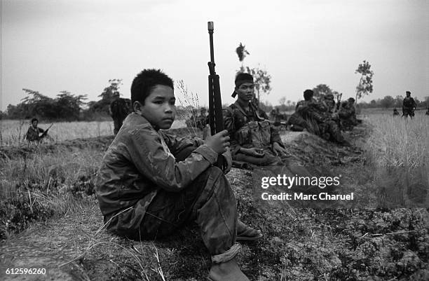 Guerillas of the Khmer People's National Liberation Front during an operation against Vietnamese Forces around the town of Sisophon.