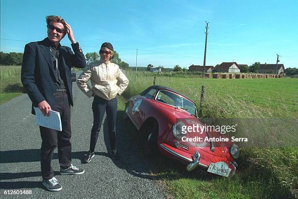 Antoine Van Doorne and Sally Woodford with their 1963 Prince of Europe Porsche in the ditch owing to a brake problem.