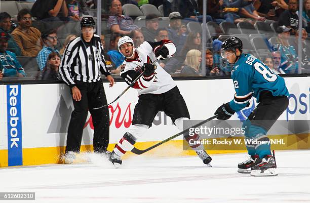 Jamie McBain of the Arizona Coyotes passes the puck against Nikolay Goldobin of the San Jose Sharks at SAP Center on September 30, 2016 in San Jose,...