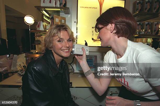 Alexandra Bronkers offers herself as 'guinea pig' to test the latest Elizabeth Arden skin analyser.