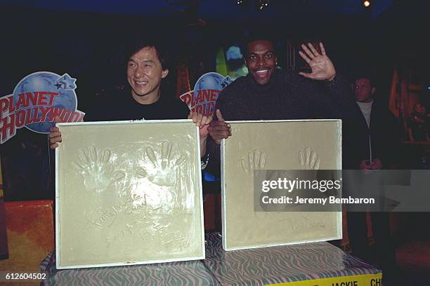 The stars of Brett Ratner's movie, Jackie Chan and Chris Tucker, leave their hand imprints.