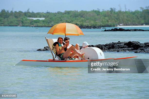 French model Ines de La Fressange, who is currently pregnant, with husband Luigi d'Urso and their daughter, Nine, on vacation in Mauritius.