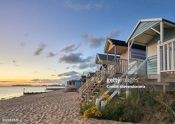 traditional beach huts on the north norfolk coast at wells next the sea - norfolk england stock pictures, royalty-free photos & images