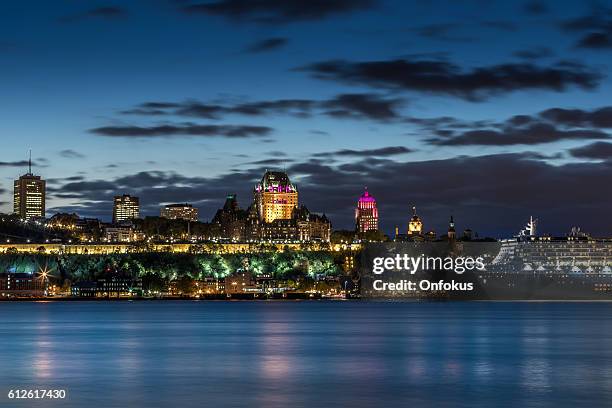 chateau frontenac illuminated at night, quebec city, canada - chateau frontenac hotel stock pictures, royalty-free photos & images