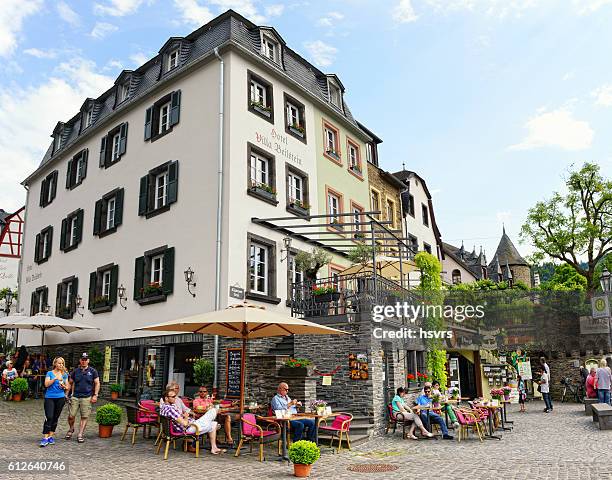 people visiting moselle river village beilstein. - cochem moselle stock pictures, royalty-free photos & images