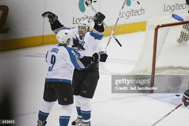 Adam Graves and Owen Nolan of the San Jose Sharks celebrate Graves's goal against the Phoenix Coyotes during game five of the Stanley Cup playoffs at...