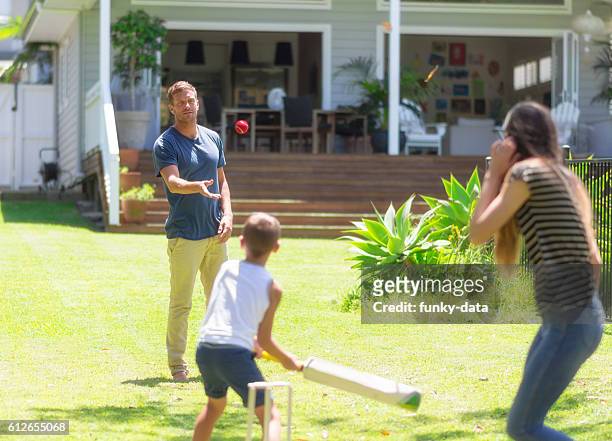 australian familie spielen cricket - lawn bowls stock-fotos und bilder