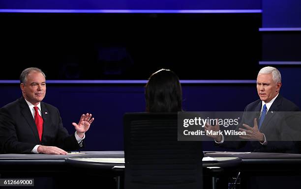 Democratic vice presidential nominee Tim Kaine and Republican vice presidential nominee Mike Pence speak as debate moderator Elaine Quijano listens...