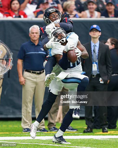 Perrish Cox of the Tennessee Titans intercepts a pass intended for DeAndre Hopkins of the Houston Texans at NRG Stadium on October 2, 2016 in...