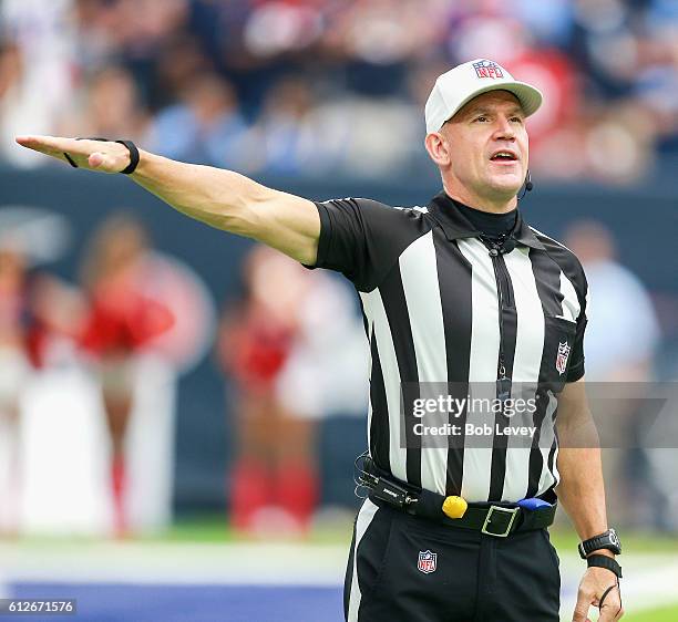 Referee Clete Blakeman makes a call during game action between Houston Texans and Tennessee Titans at NRG Stadium on October 2, 2016 in Houston,...