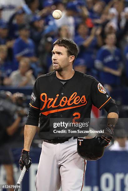 Hardy of the Baltimore Orioles reacts after striking out in the fifth inning against the Toronto Blue Jays during the American League Wild Card game...