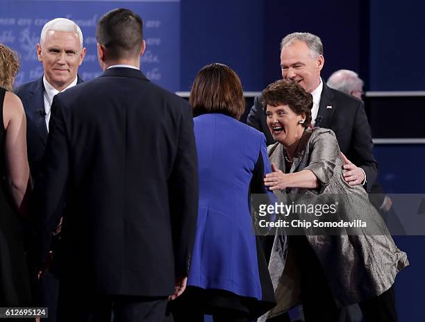 Karen Pence and Anne Holton shake hands after their spouses Republican vice presidential nominee Mike Pence and Democratic vice presidential nominee...