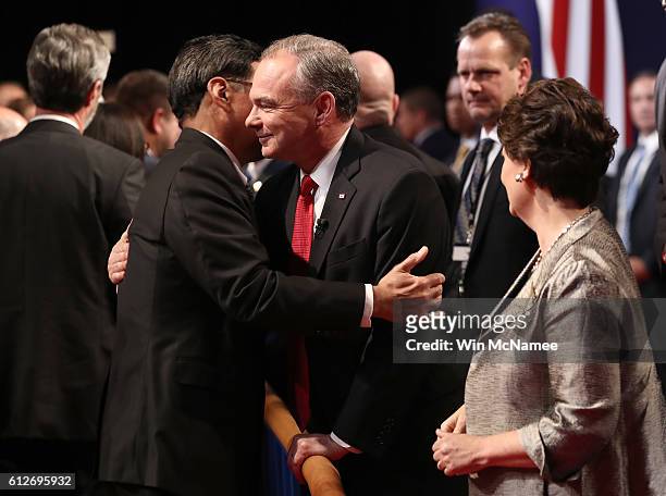Democratic vice presidential nominee Tim Kaine is greeted by a supporter alongside his wife Anne Holton following the Vice Presidential Debate with...