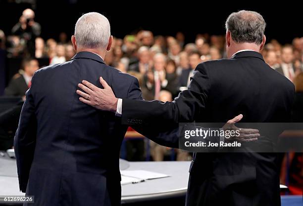 Republican vice presidential nominee Mike Pence and Democratic vice presidential nominee Tim Kaine meet on stage following the Vice Presidential...