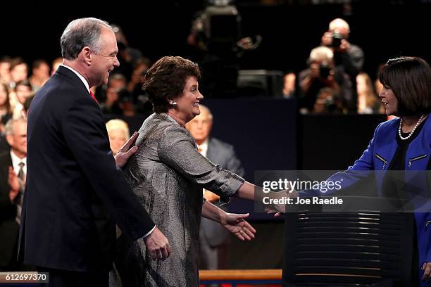 Democratic vice presidential nominee Tim Kaine and wife Anne Holton shake hands with Karen Pence following the Vice Presidential Debate with...