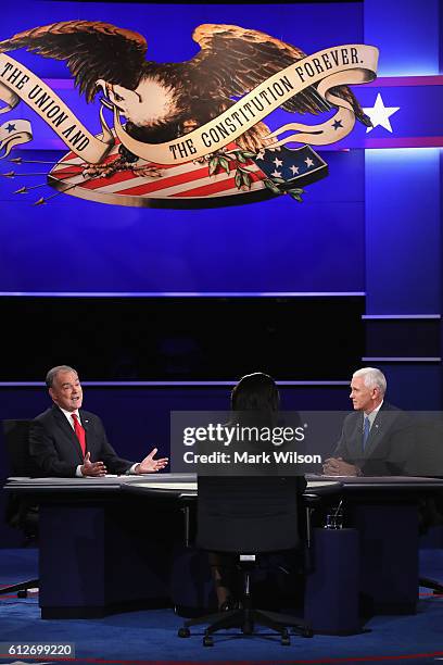 Democratic vice presidential nominee Tim Kaine and Republican vice presidential nominee Mike Pence debate as moderator Elaine Quijano listens during...